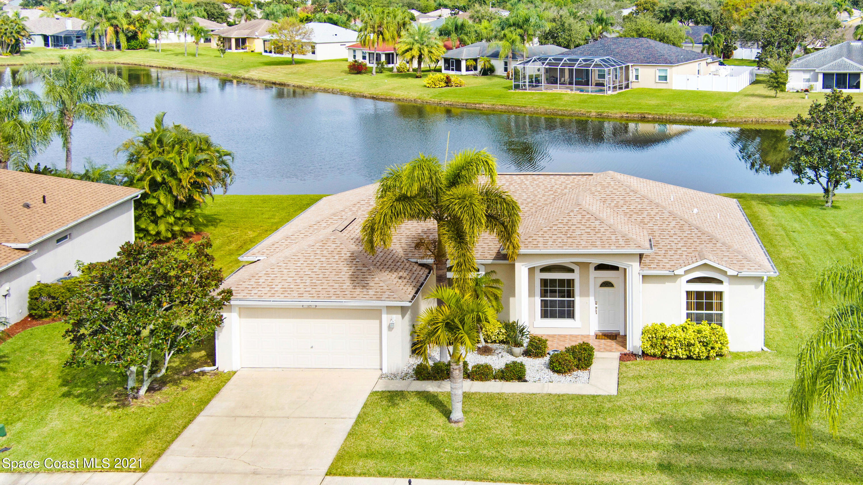 1475 Knoll Ridge Drive Melbourne, FL 32940 - Photo 1 of 39 a view of a house with a yard and lake view