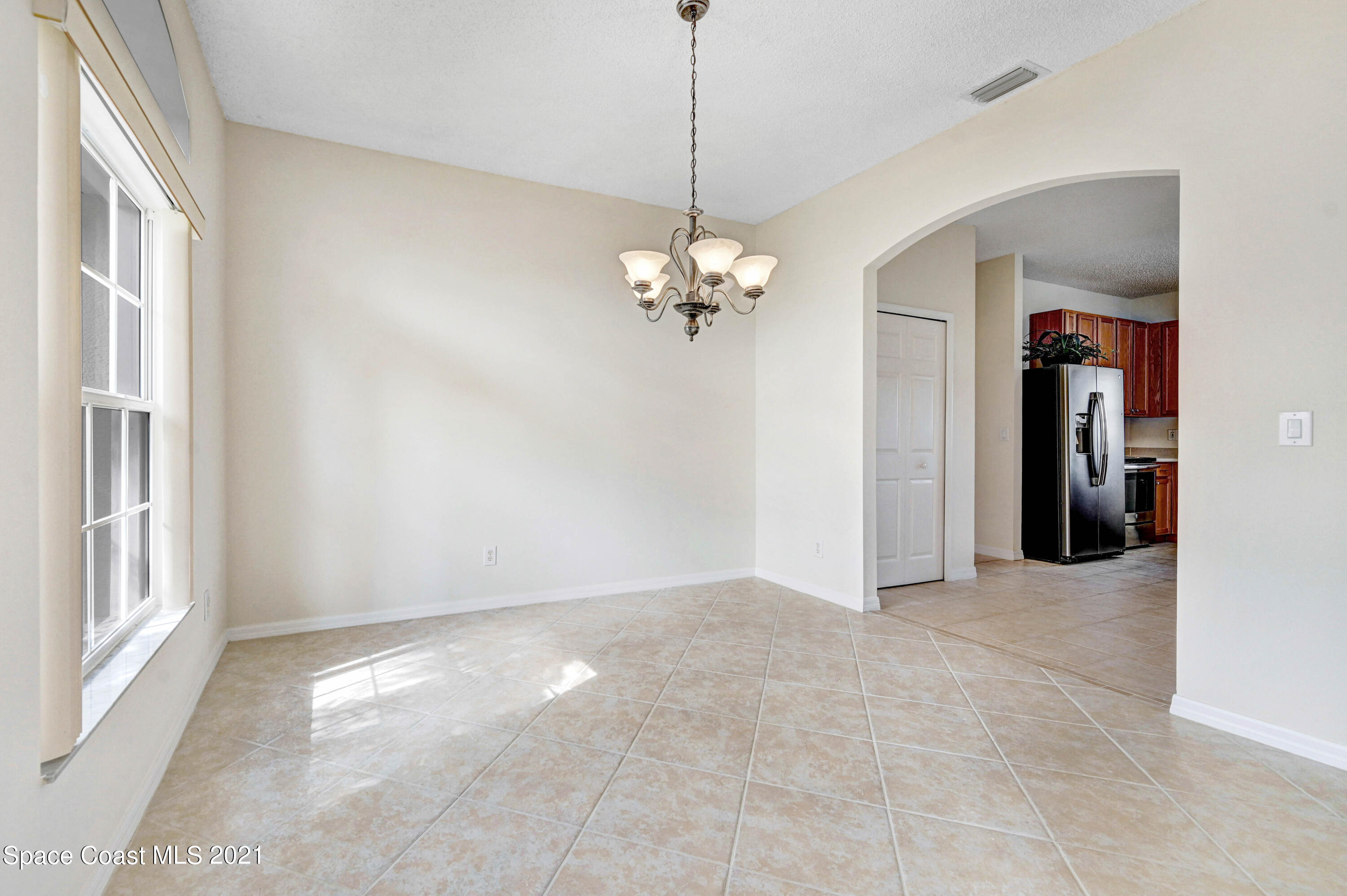 1475 Knoll Ridge Drive Melbourne, FL 32940 - Photo 12 of 39 a view of a chandelier in big room and chandelier