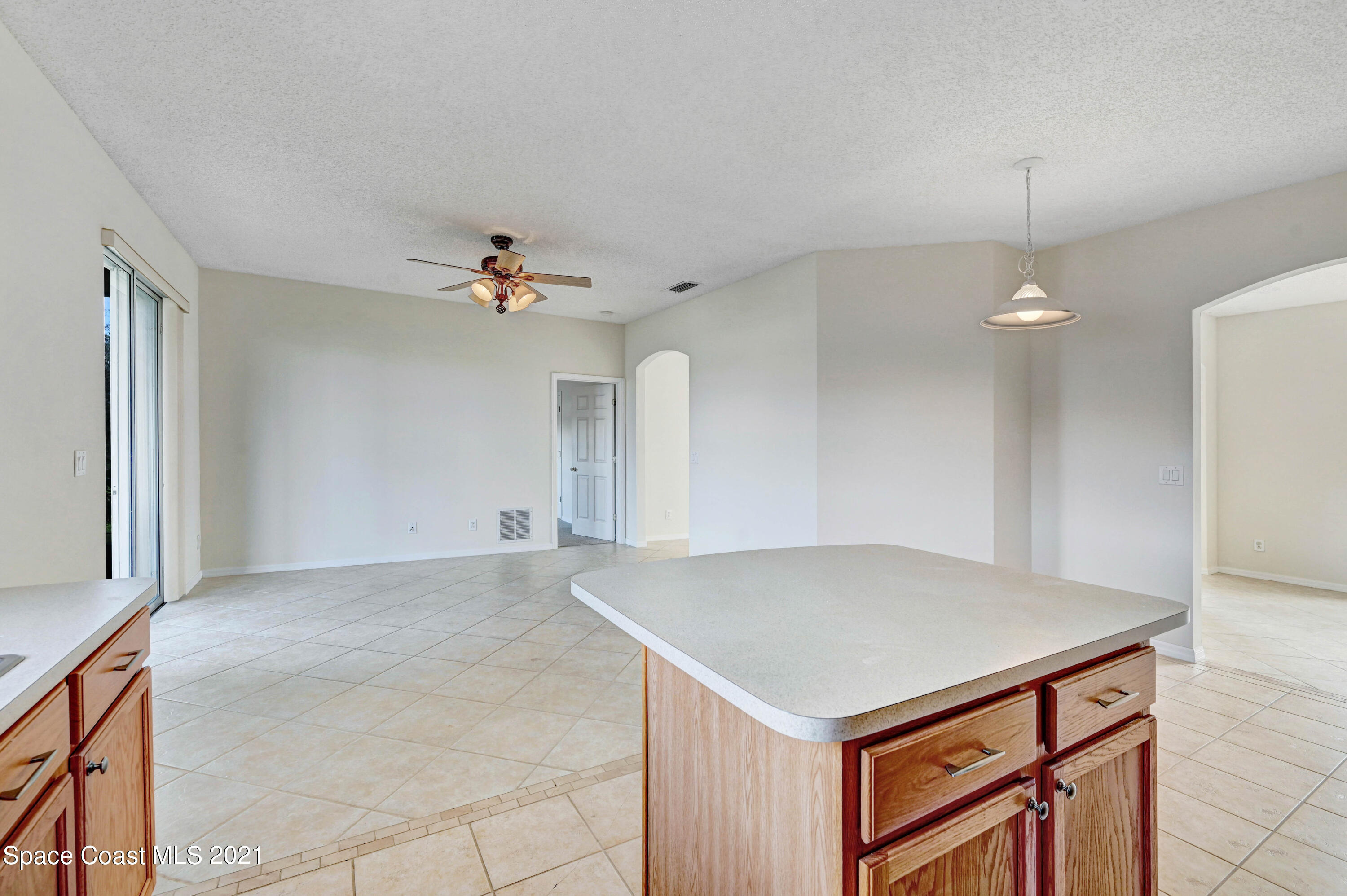 1475 Knoll Ridge Drive Melbourne, FL 32940 - Photo 19 of 39 wooden floor in an empty room with a window