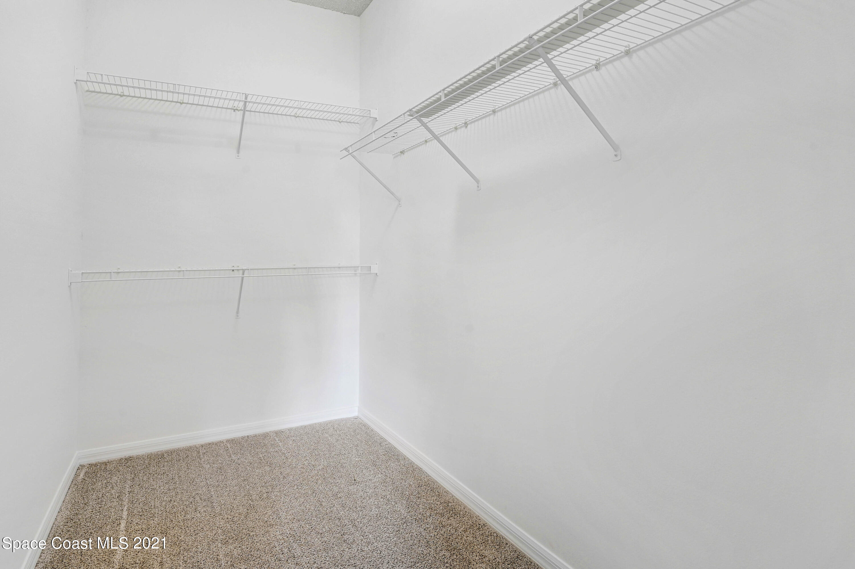 1475 Knoll Ridge Drive Melbourne, FL 32940 - Photo 26 of 39 a view of a room with racks on the wall