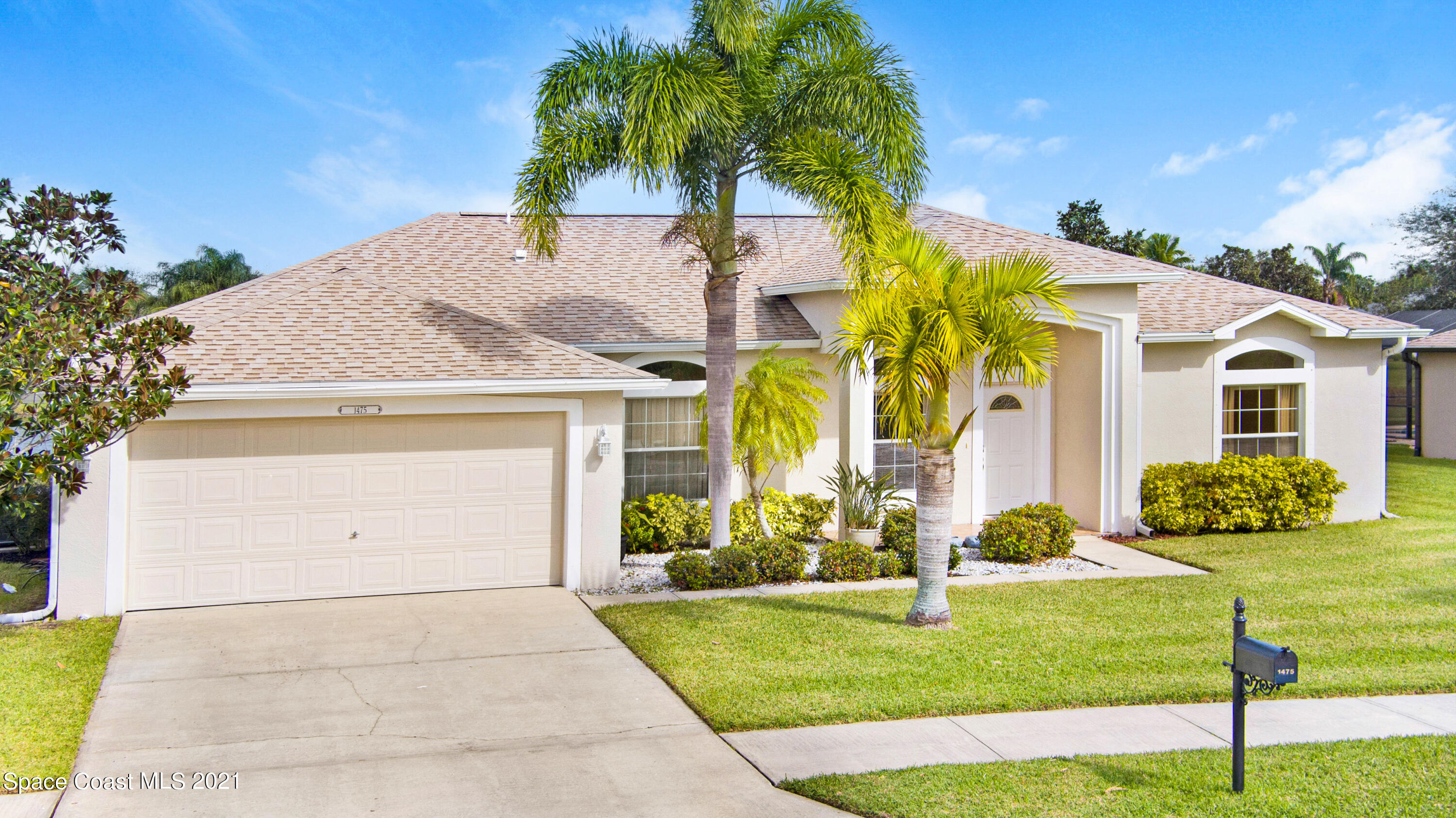 1475 Knoll Ridge Drive Melbourne, FL 32940 - Photo 32 of 39 a front view of a house with garden