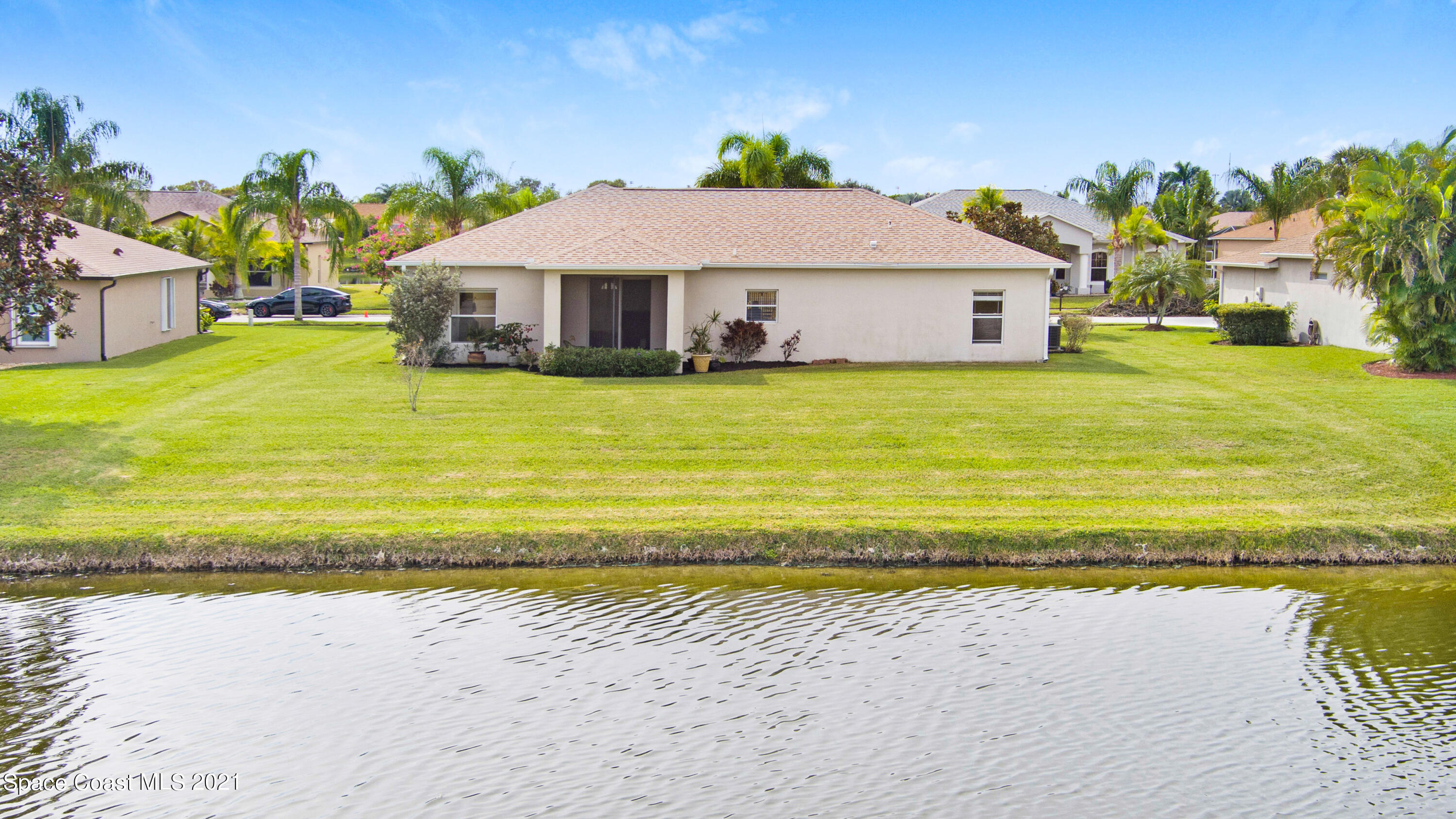 1475 Knoll Ridge Drive Melbourne, FL 32940 - Photo 37 of 39 a front view of a house with a ocean view