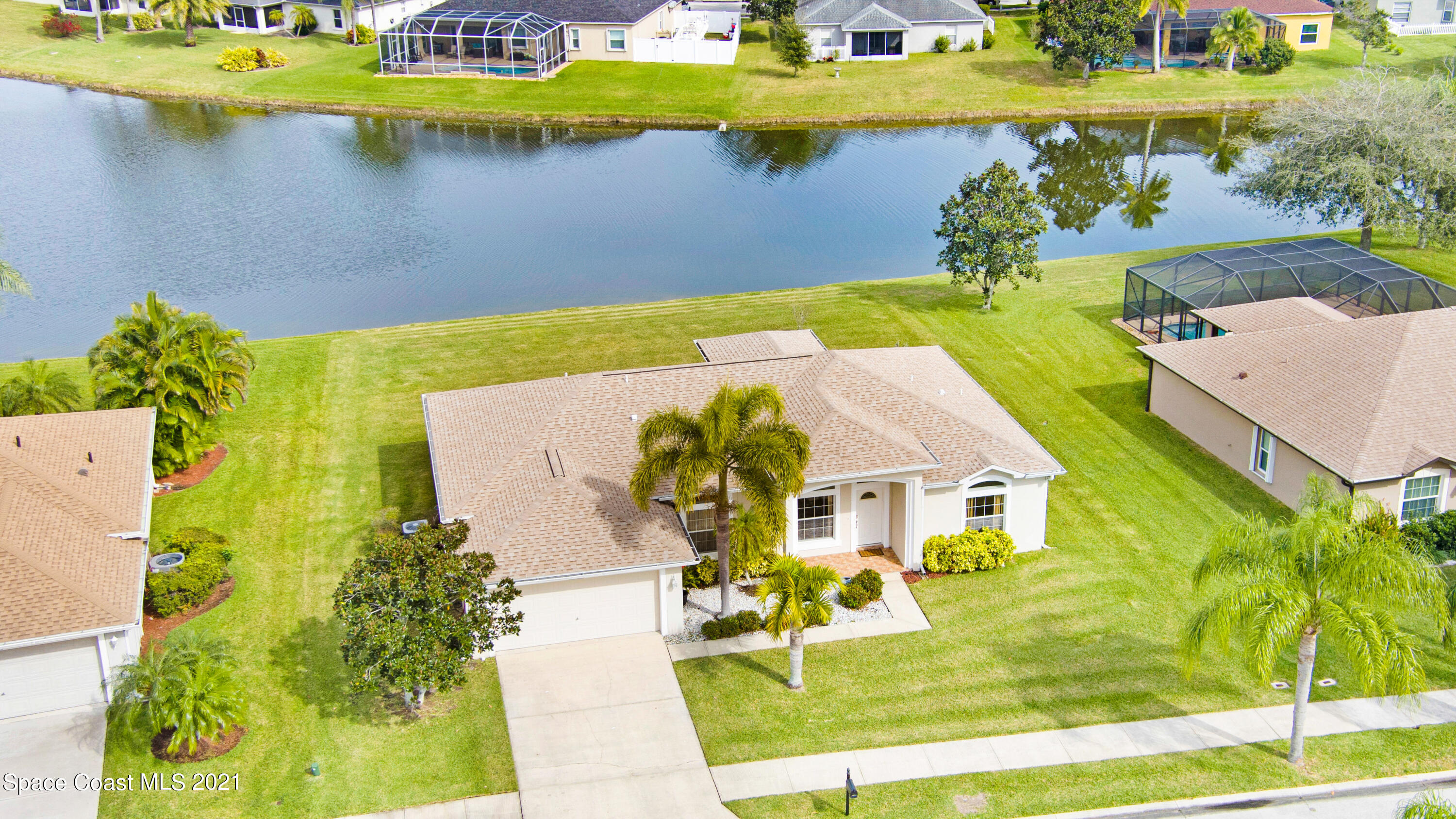 1475 Knoll Ridge Drive Melbourne, FL 32940 - Photo 4 of 39 an aerial view of a house with a swimming pool