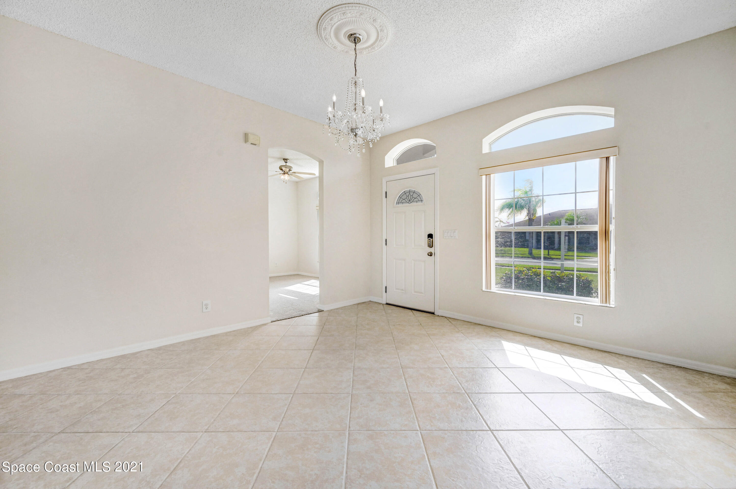 1475 Knoll Ridge Drive Melbourne, FL 32940 - Photo 10 of 39 a view of an empty room with a window
