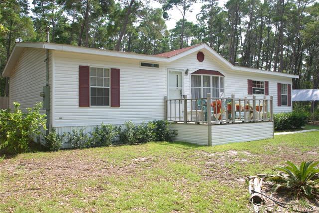 52 Earl Road Rosemary Beach, FL 32461 - Photo 1 of 1 a front view of house with yard and green space