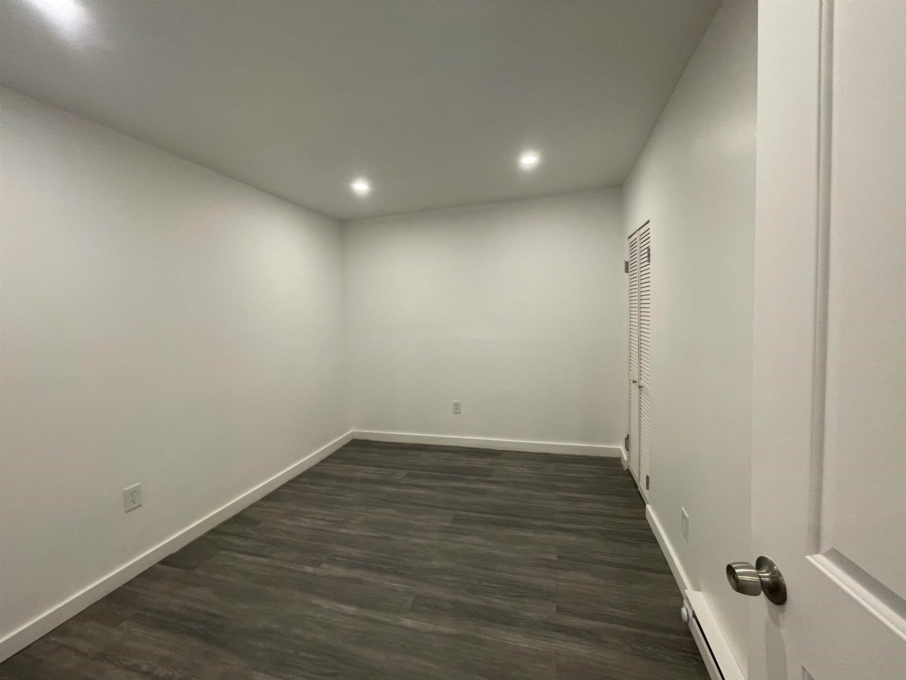 516 Paterson Plank Road, Unit 2R Jersey City, NJ 07307 - Photo 6 of 13 a view of a hallway with wooden floor