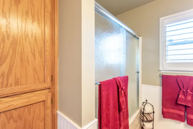 a bathroom with a mirror and a shower curtain