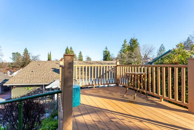 a view of a balcony with wooden floor