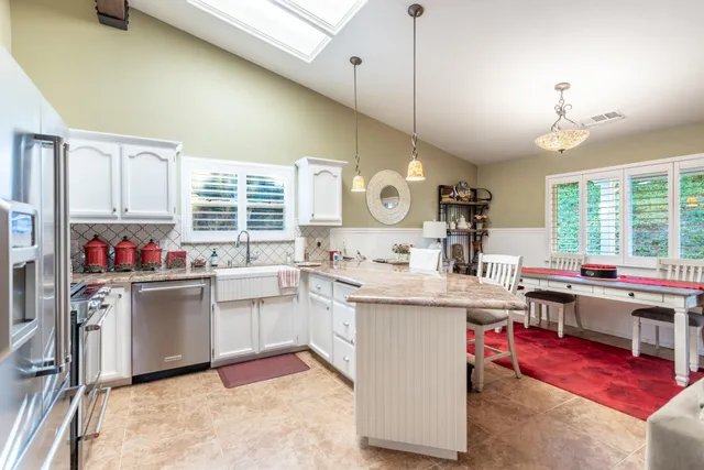 a kitchen with a stove and cabinets