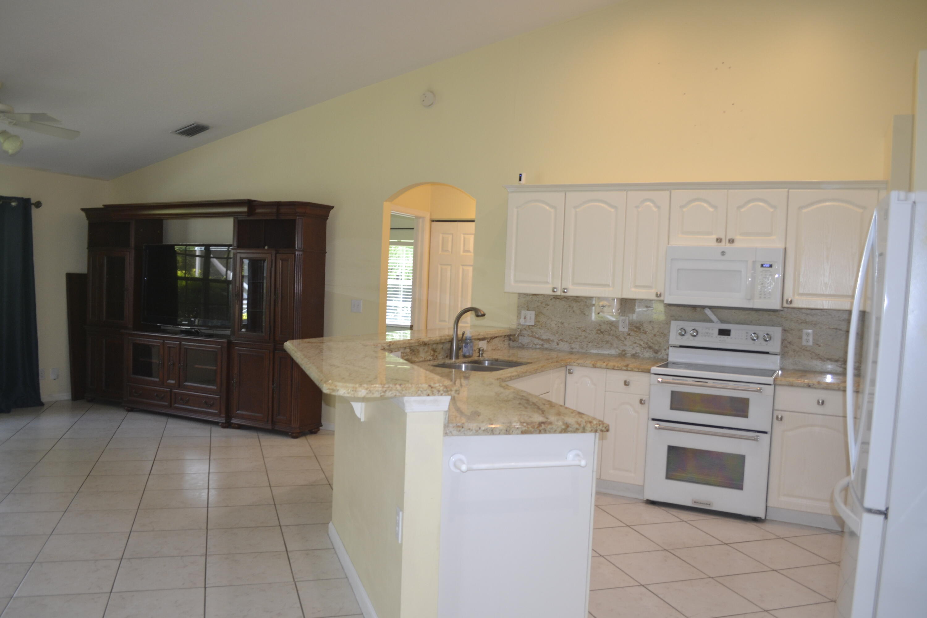 1104 Raintree Lane Wellington, FL 33414 - Photo 6 of 30 Kitchen open Family rm