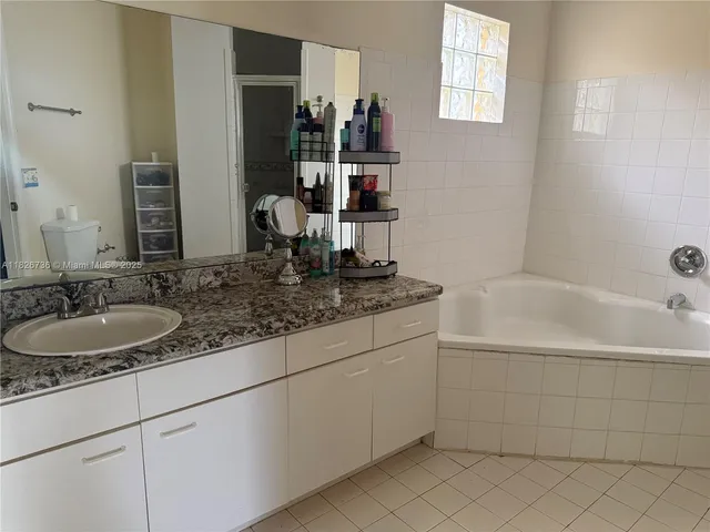 a bathroom with a sink and a bathtub