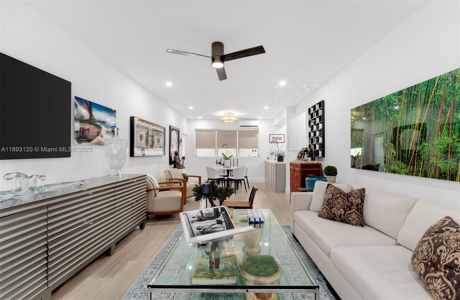 4720 Pine Tree Drive, Unit 2 Miami Beach, FL 33140 - Photo 4 of 23 a living room with furniture and a flat screen tv