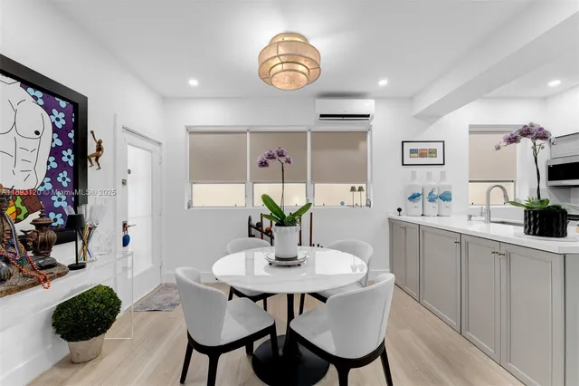 a dining room with furniture and window