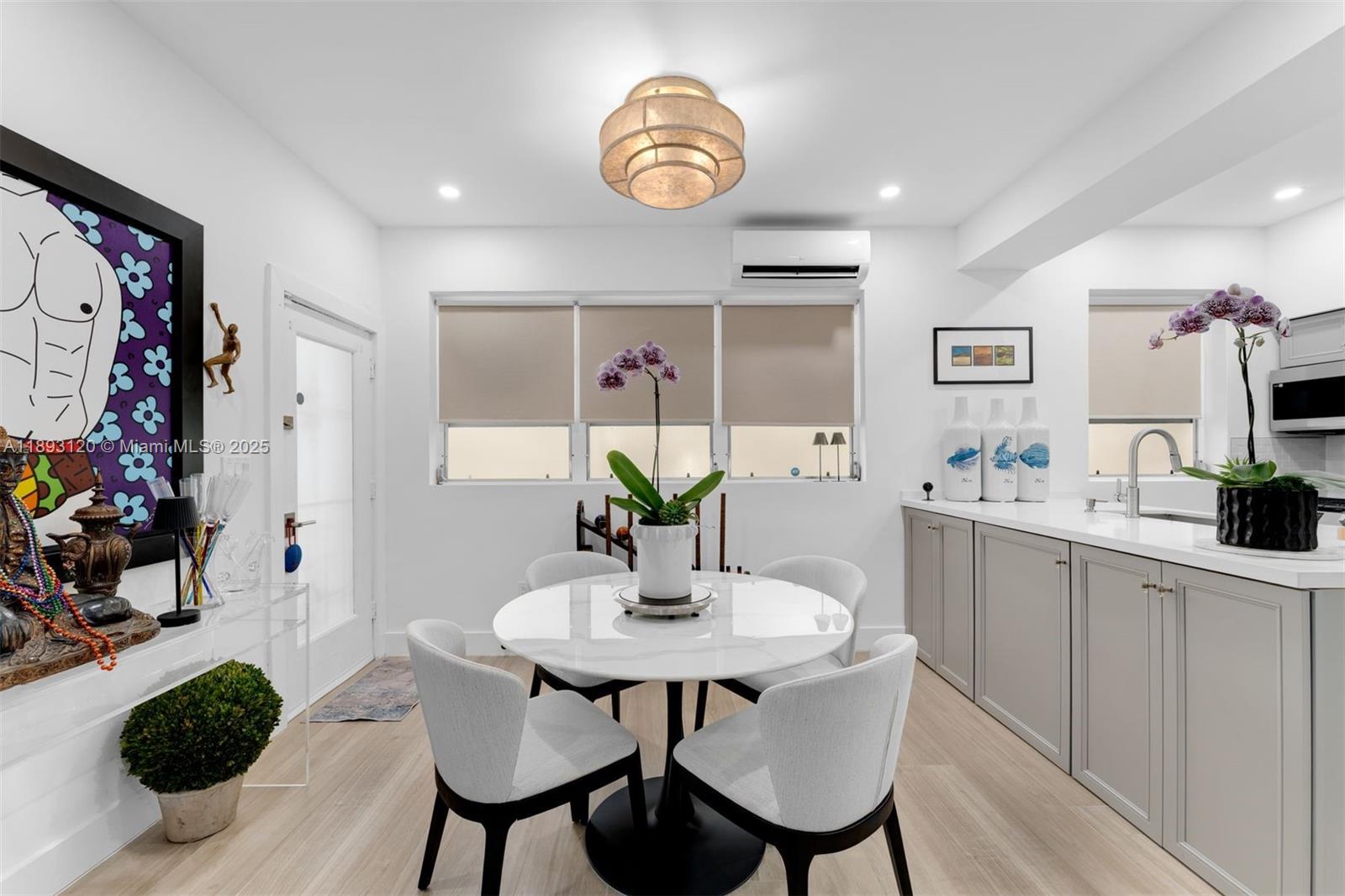 4720 Pine Tree Drive, Unit 2 Miami Beach, FL 33140 - Photo 6 of 23 a dining room with furniture and window