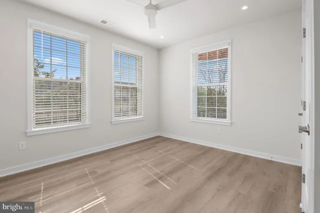 a bathroom with a double vanity sink toilet and shower