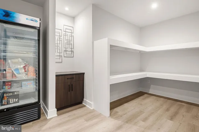 a room with gym equipment and a flat screen tv