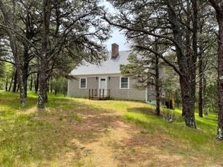 236 Chappaquiddick Road Edgartown, MA 02539 - Photo 1 of 16 a view of a house with a yard and a tree