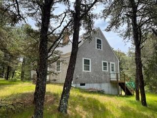 236 Chappaquiddick Road Edgartown, MA 02539 - Photo 2 of 16 a view of a house with a yard