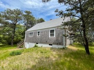 236 Chappaquiddick Road Edgartown, MA 02539 - Photo 4 of 16 a front view of a house with a yard