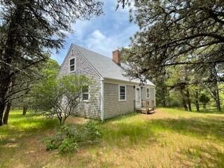 236 Chappaquiddick Road Edgartown, MA 02539 - Photo 5 of 16 a view of a house with a yard