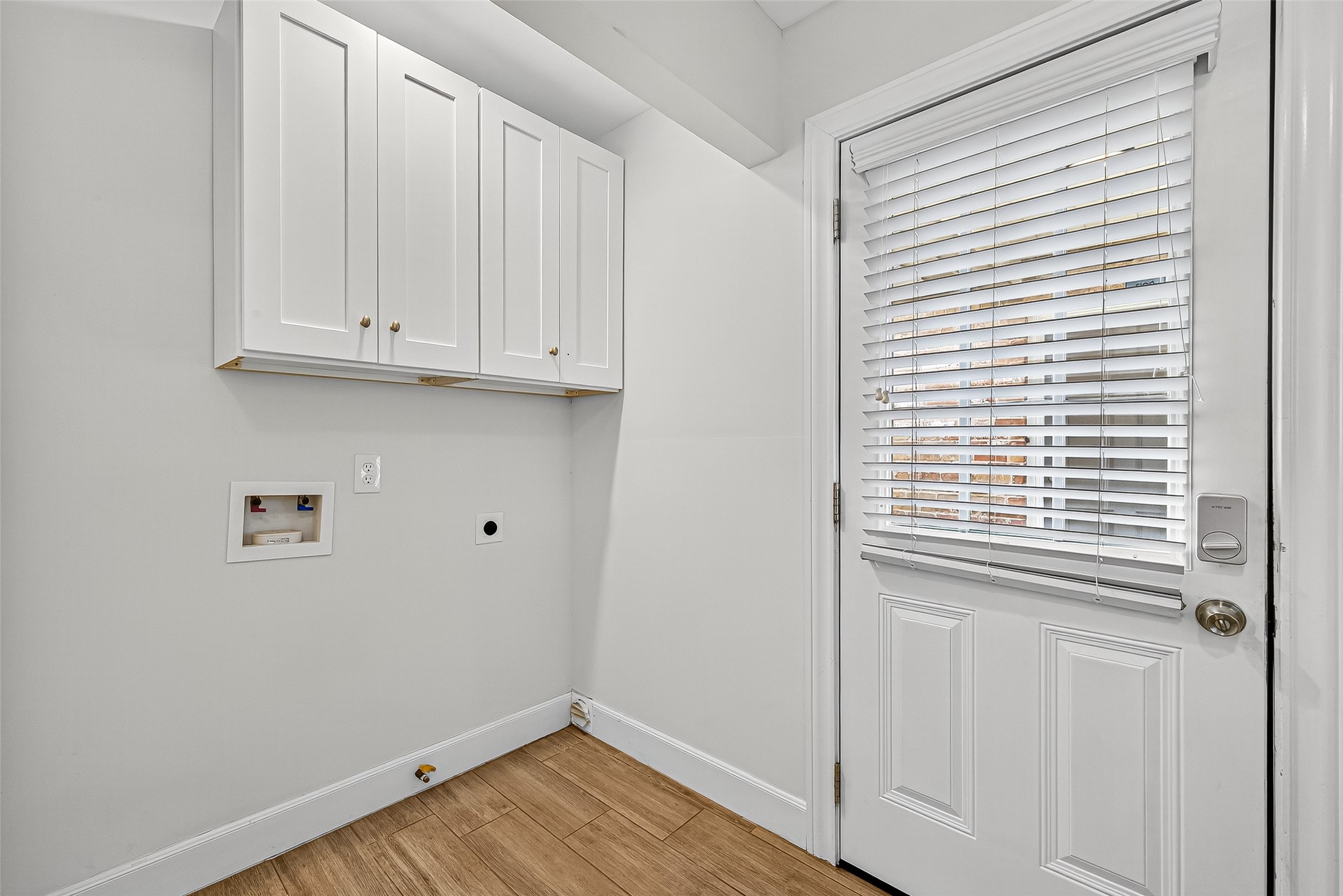 818 Silvergate Drive Houston, TX 77079 - Photo 20 of 40 a view of an empty room with wooden floor and a window