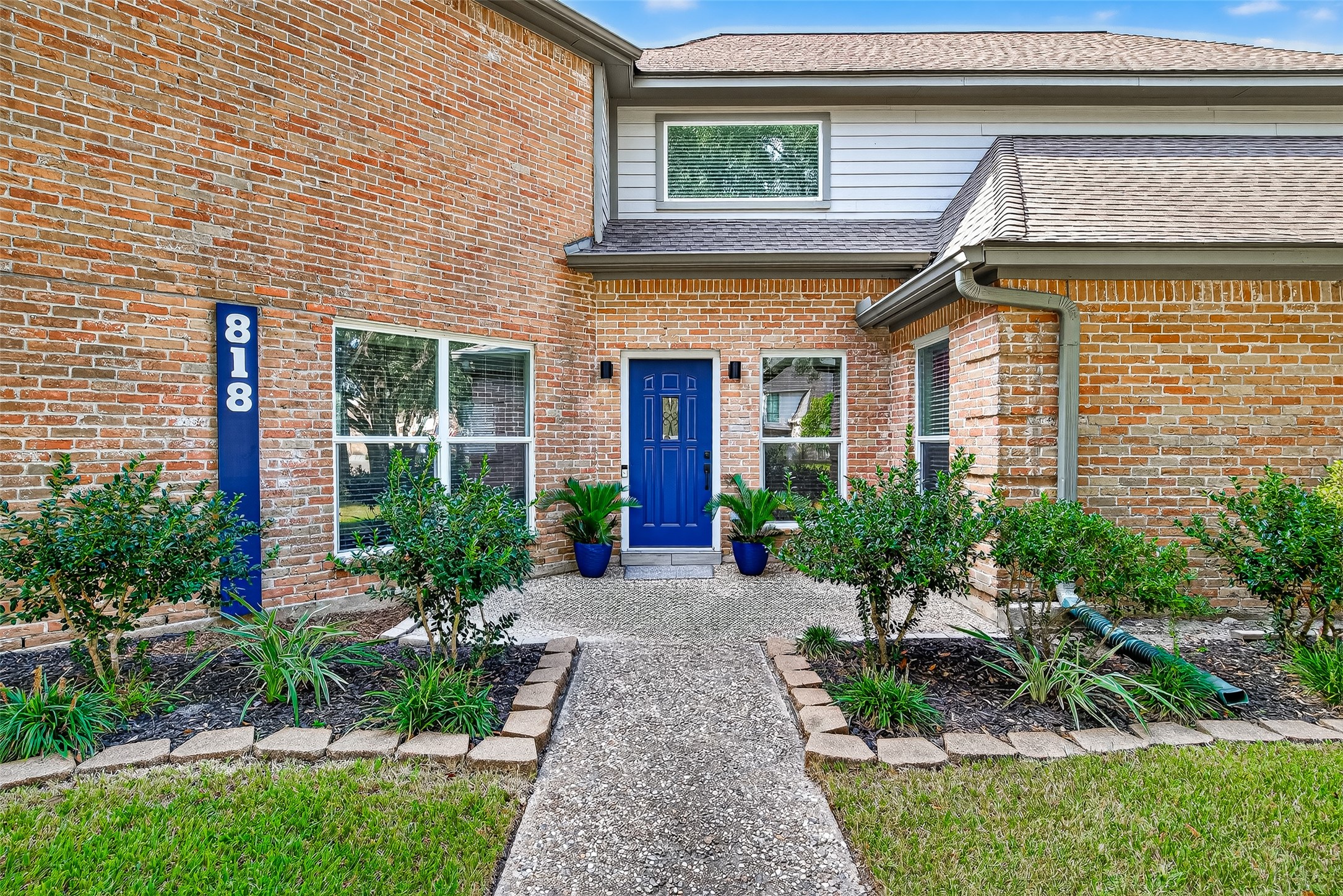 818 Silvergate Drive Houston, TX 77079 - Photo 3 of 40 a front view of a house with garden and outdoor seating