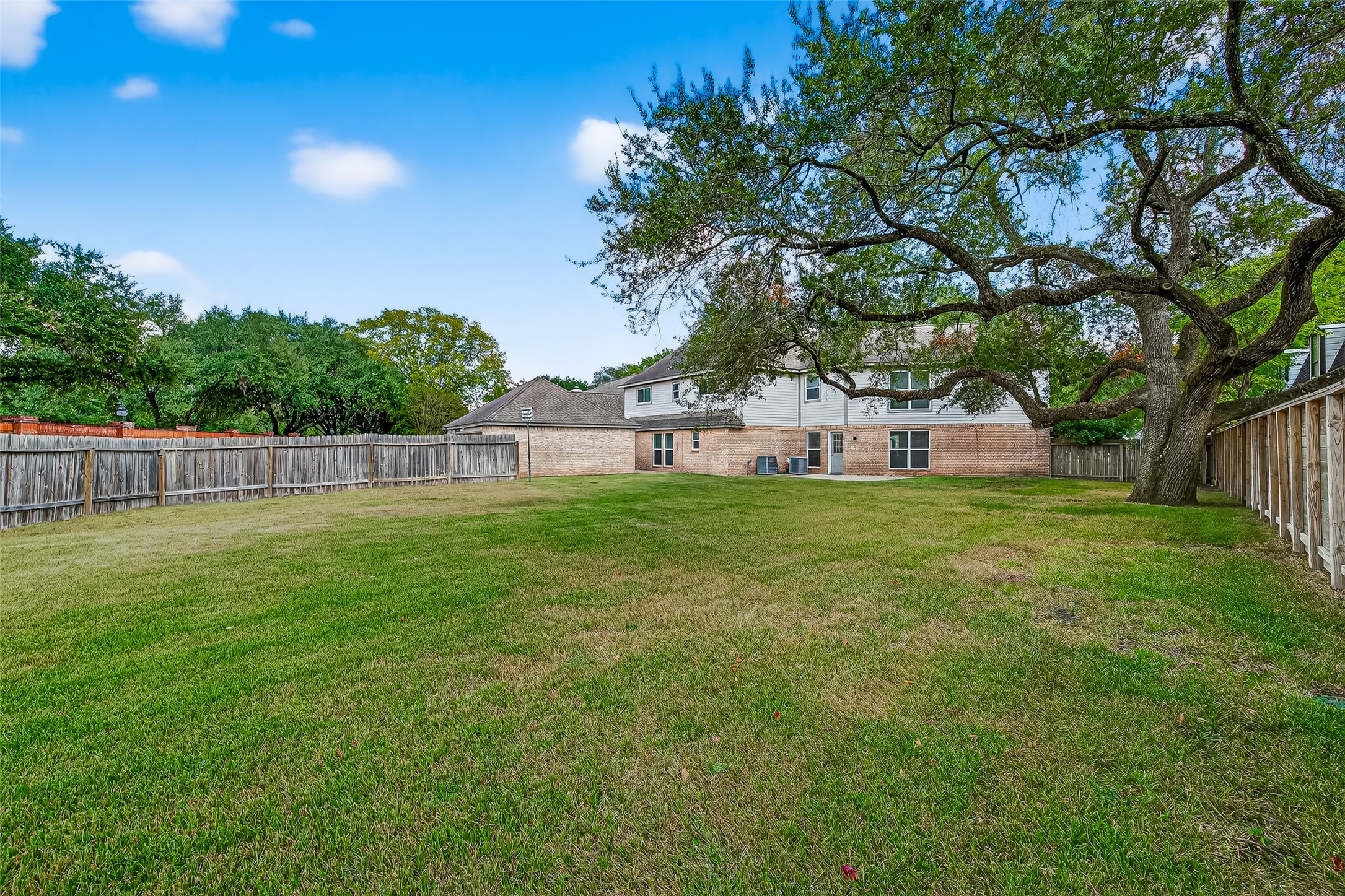 818 Silvergate Drive Houston, TX 77079 - Photo 38 of 40 a view of house with backyard and tree