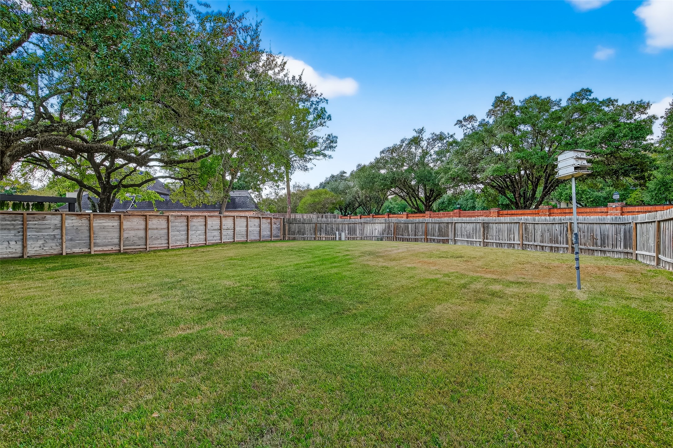 818 Silvergate Drive Houston, TX 77079 - Photo 40 of 40 a view of a yard with wooden fence