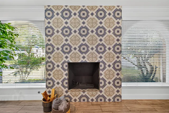 a living room with a fireplace and a flat screen tv