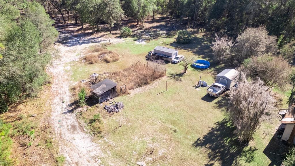 815 Northeast 145th Avenue Road Silver Springs, FL 34488 - Photo 27 of 42 a view of swimming pool with a yard