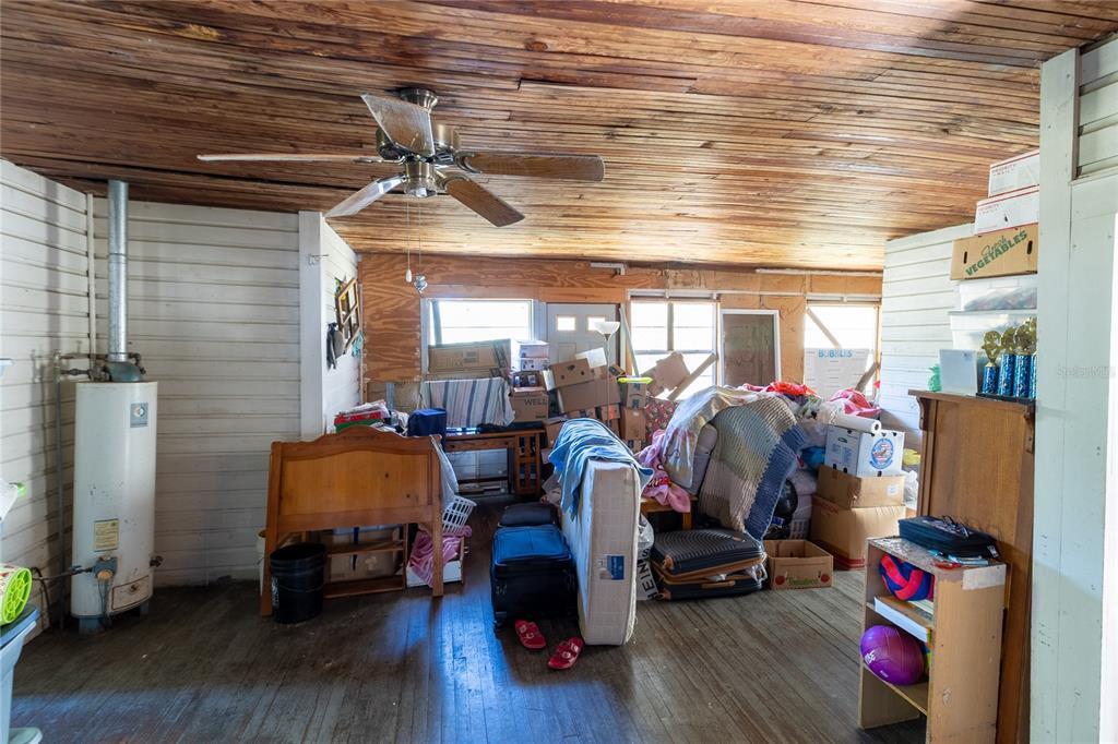 815 Northeast 145th Avenue Road Silver Springs, FL 34488 - Photo 28 of 42 a room with gym equipment and wooden floor