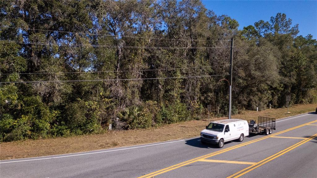 815 Northeast 145th Avenue Road Silver Springs, FL 34488 - Photo 3 of 42 a car parked on the side of the road