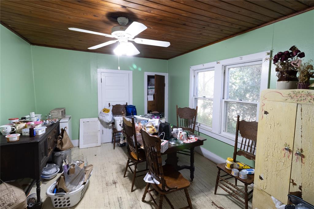 815 Northeast 145th Avenue Road Silver Springs, FL 34488 - Photo 34 of 42 a dining room with furniture and window