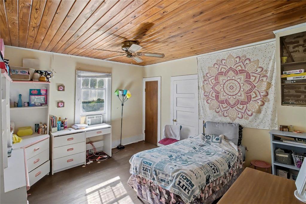 815 Northeast 145th Avenue Road Silver Springs, FL 34488 - Photo 37 of 42 a bedroom with a bed dresser and a window