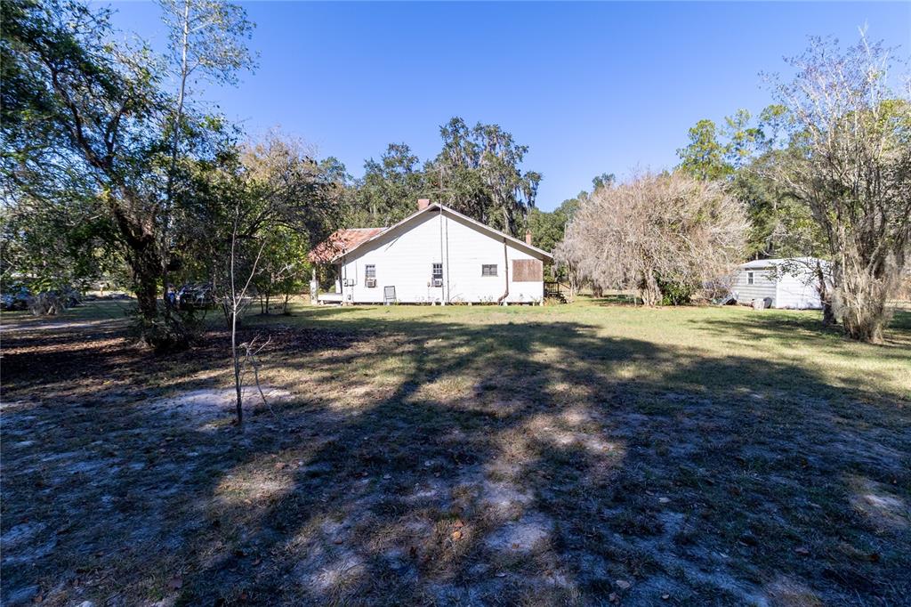 815 Northeast 145th Avenue Road Silver Springs, FL 34488 - Photo 39 of 42 a view of big yard with large trees
