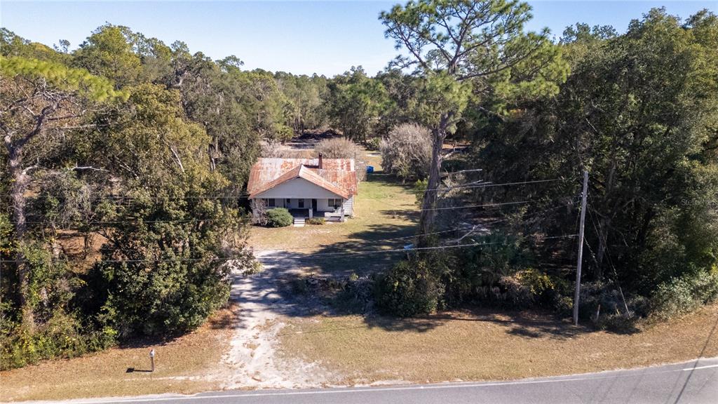 815 Northeast 145th Avenue Road Silver Springs, FL 34488 - Photo 4 of 42 a view of a house with a yard