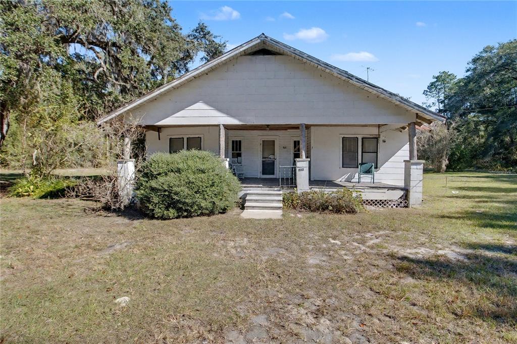 815 Northeast 145th Avenue Road Silver Springs, FL 34488 - Photo 42 of 42 front view of a house with a yard