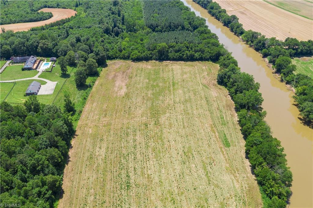 8188 Hampton Road Clemmons, NC 27012 - Photo 8 of 30 This is the back field of the property that borders Yadkin river as seen on the right. A farmer has been leasing part of this field to grow crops.