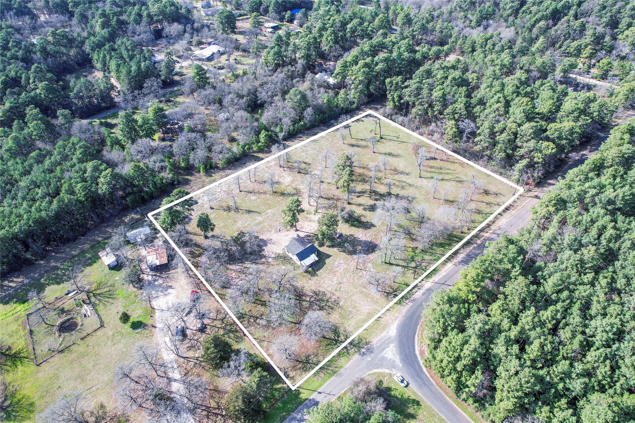 6445 North Hill Road Navasota, TX 77868 - Photo 11 of 11 an aerial view of a house with a yard and plants