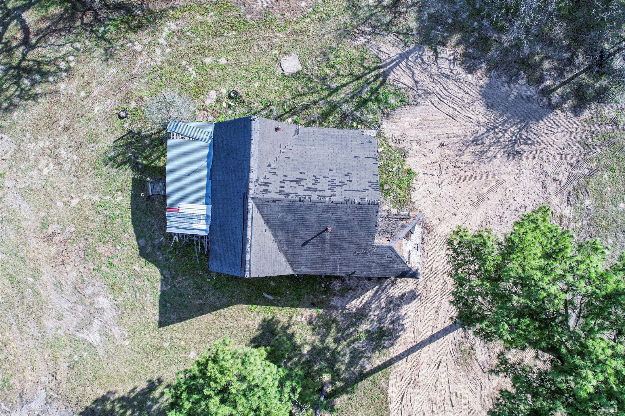 6445 North Hill Road Navasota, TX 77868 - Photo 4 of 11 an aerial view of a house with a yard