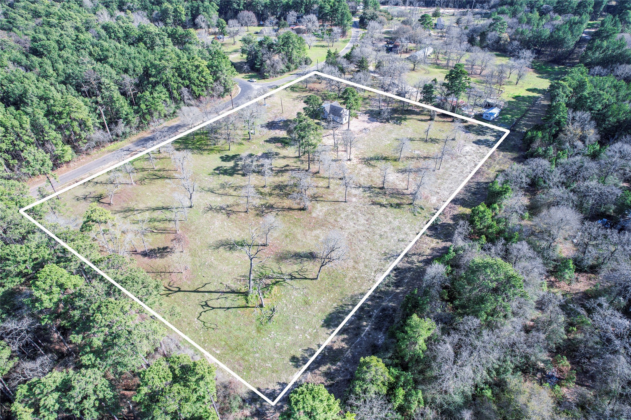6445 North Hill Road Navasota, TX 77868 - Photo 8 of 11 an aerial view of residential houses with outdoor space