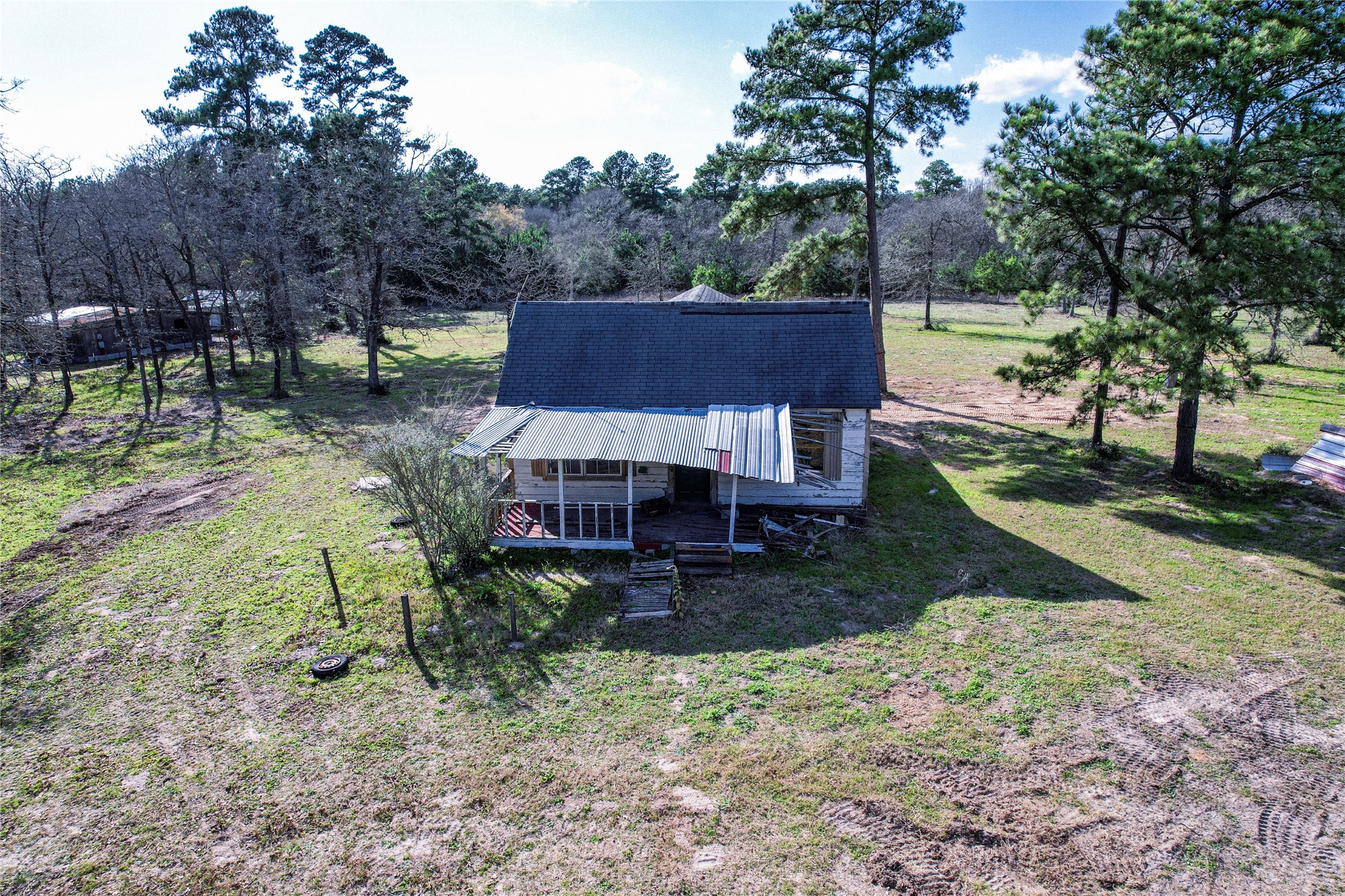 6445 North Hill Road Navasota, TX 77868 - Photo 9 of 11 a view of a house with a yard