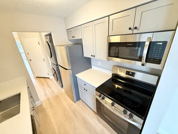 a kitchen with a stove and a microwave
