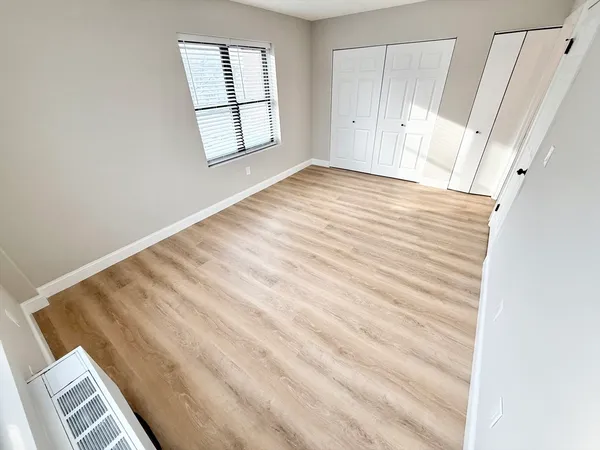 a view of an empty room with a window