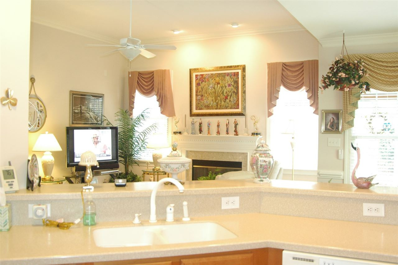 7316 Fontana Ridge Lane Raleigh, NC 27613 - Photo 10 of 20 View from behind the kitchen bartop counter into the open family room Kitchen