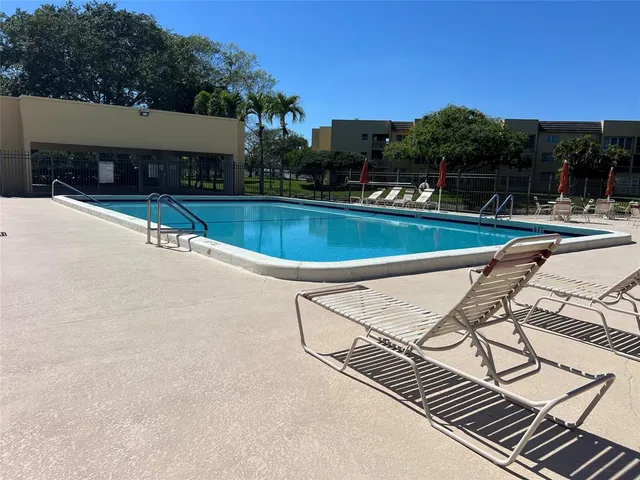 a view of a swimming pool with a patio