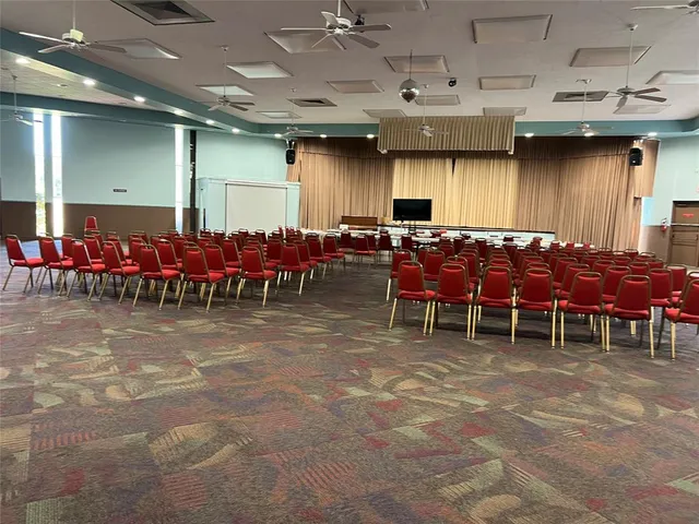 a view of a chairs and tables in a patio