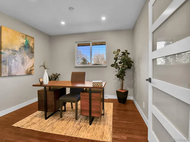 a view of a workspace with furniture