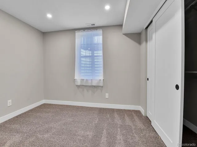 a view of a patio with table and chairs and potted plants
