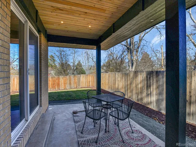 a front view of house with yard and seating area